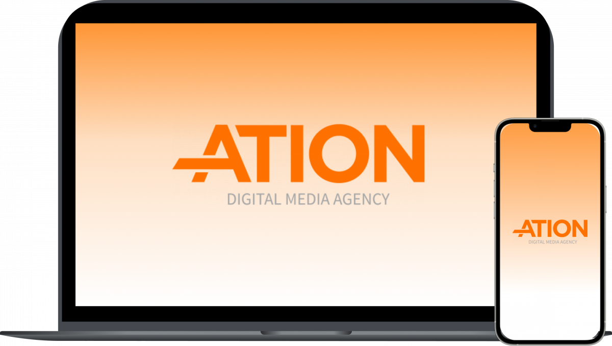 An open macbook with an orange gradient and the ATION logo on the screen, a mobile phone in front of the macbook with the same orange gradient and ATION logo